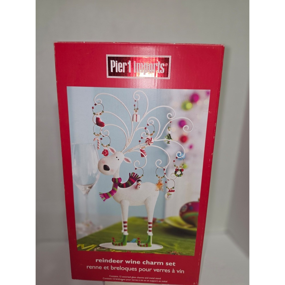 Pier 1 Imports reindeer wine charm set featuring a decorative metal stand
